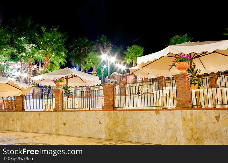 Night view of table set in the garden