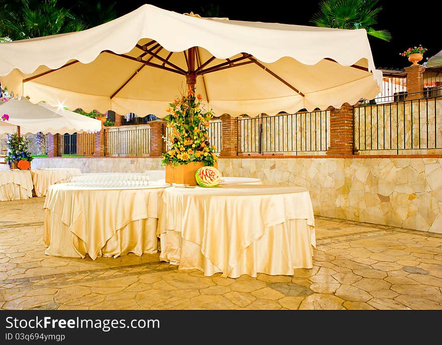 Night view of table set in the garden