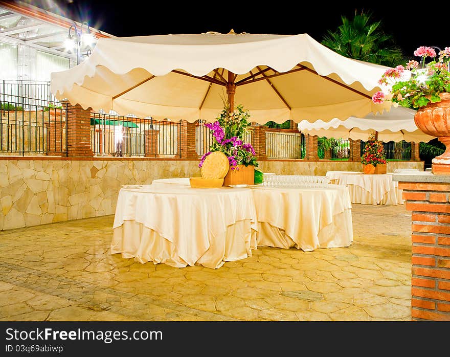 Night view of table set in the garden