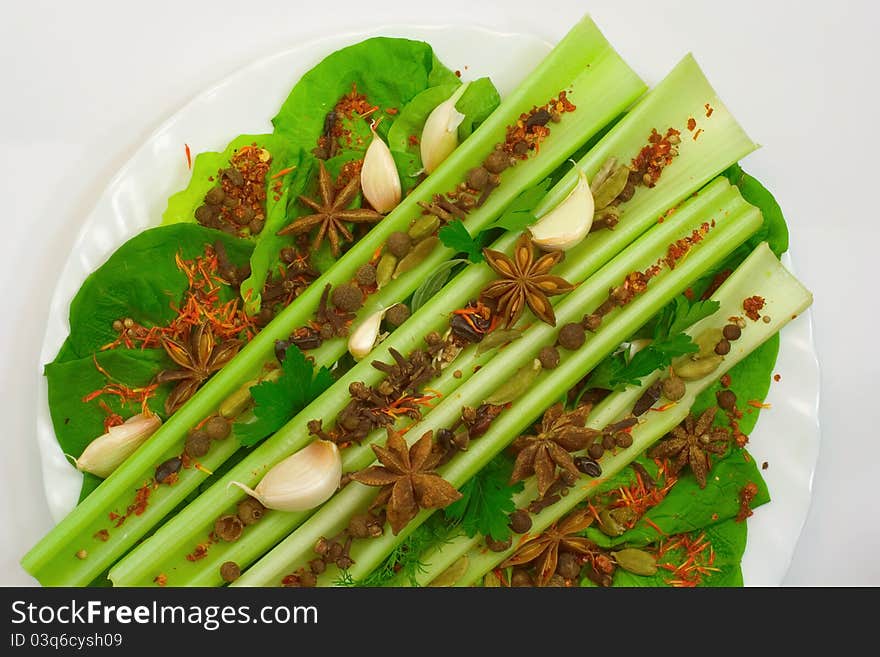 Aromatic spices on a white plate