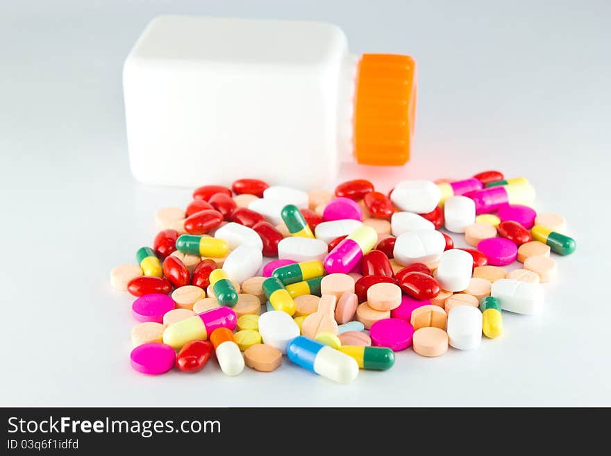 Colorful tablets with capsules and bottle