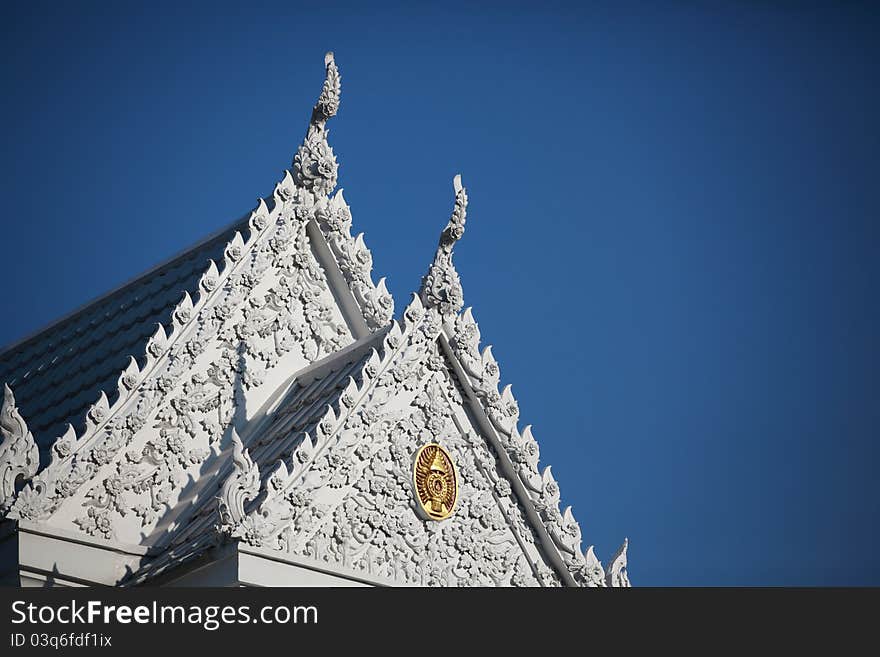 Buddhist temple with blue sky in thailand