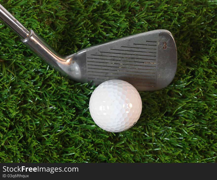 Golfing equipment on artficial grass outdoors