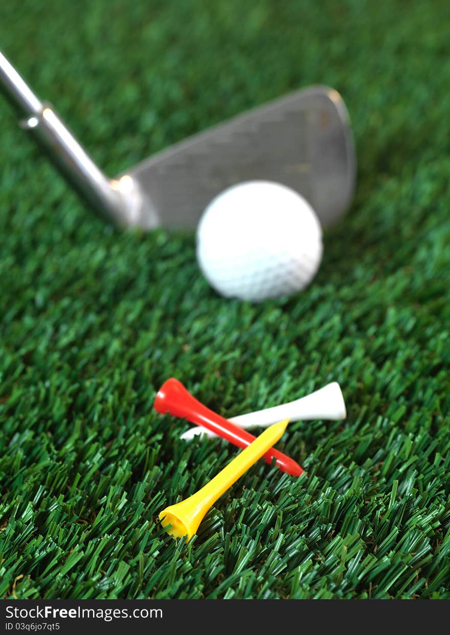 Golfing equipment on artficial grass outdoors