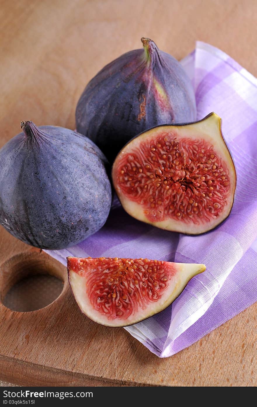 Slice fig on wood background. Slice fig on wood background