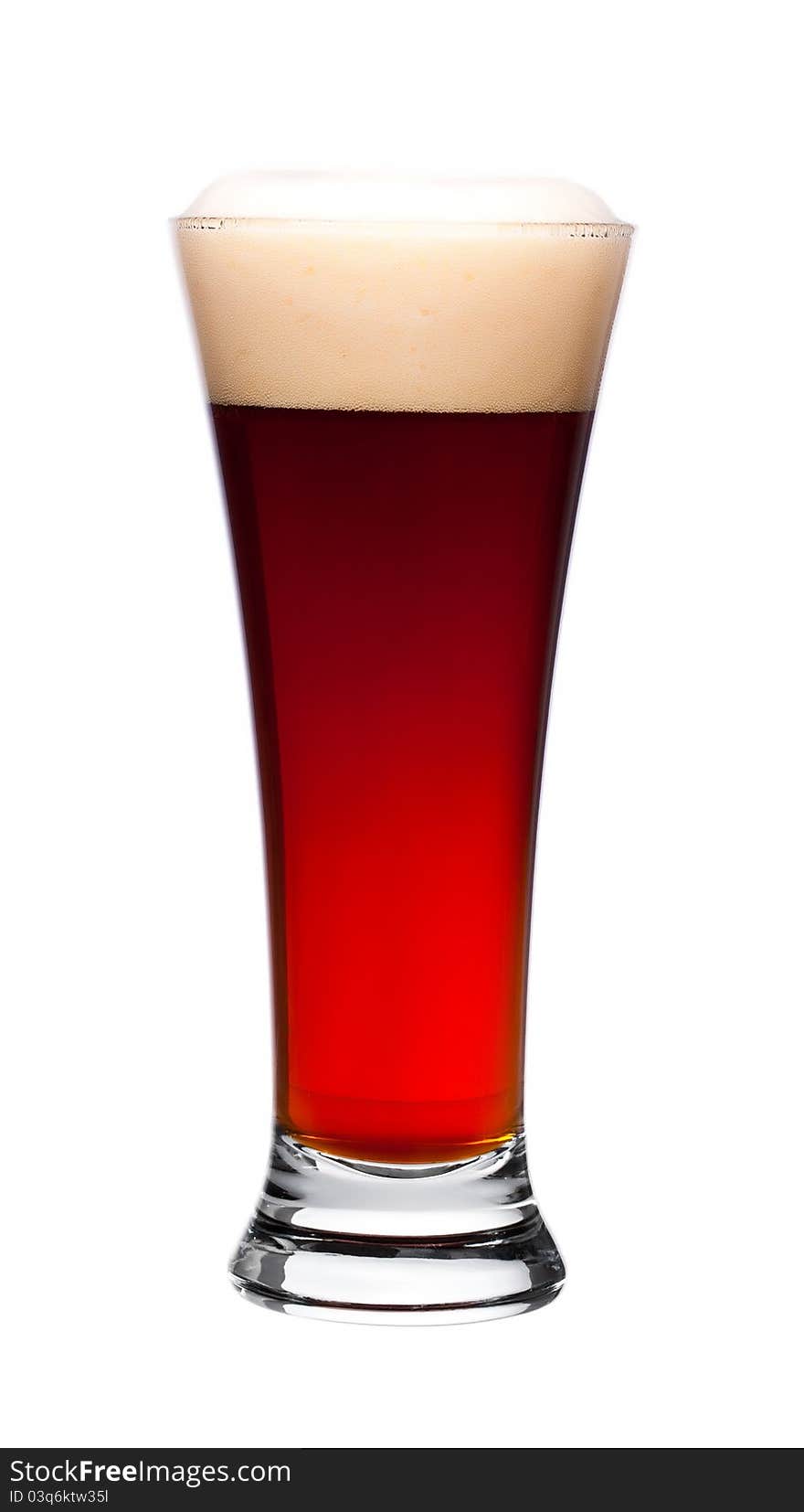 Glass of dark beer on white background