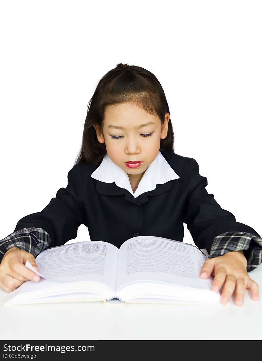 Girl reading a book at the table