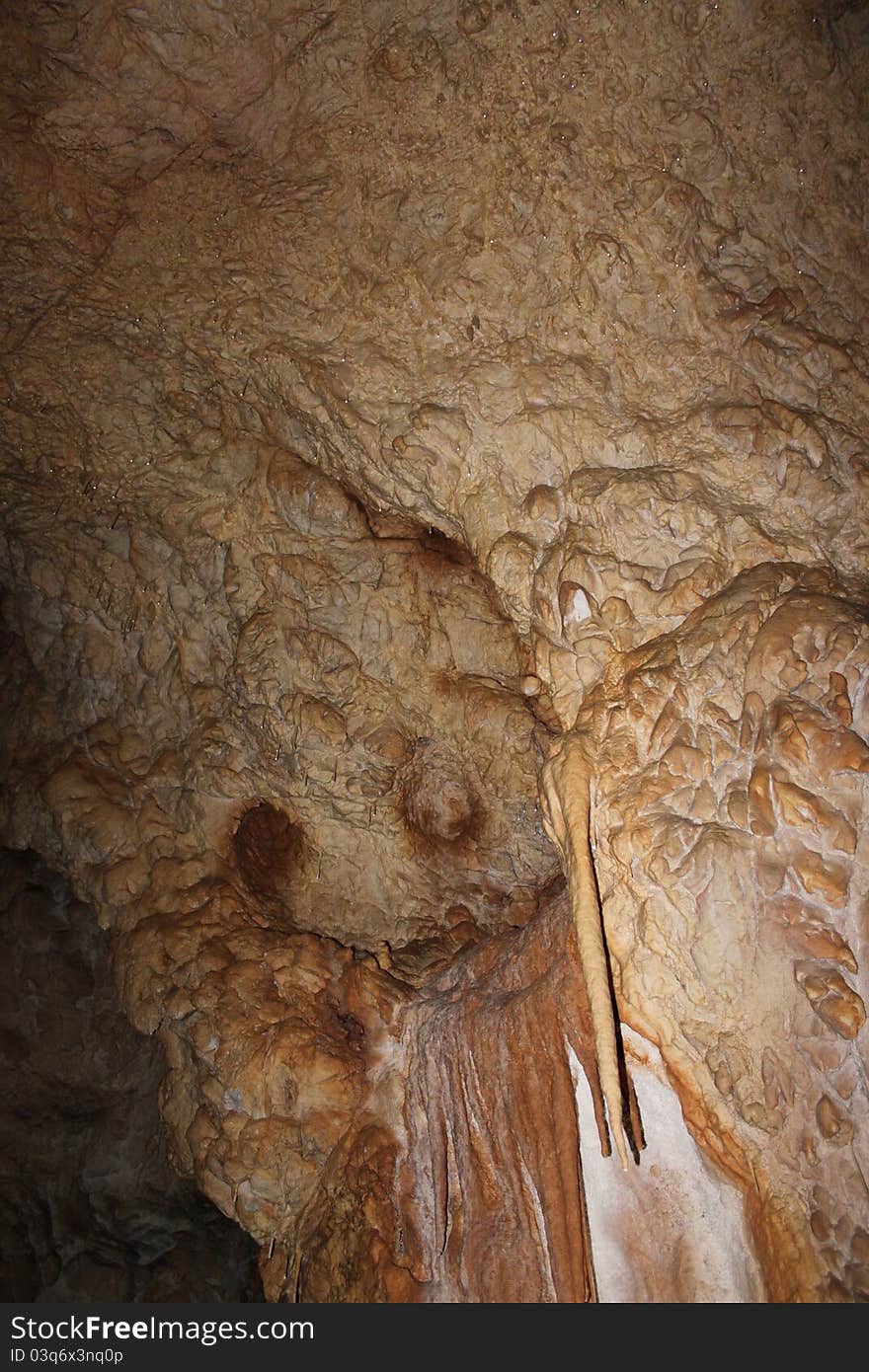 Stalactites in the cave on the wall, background. Stalactites in the cave on the wall, background.