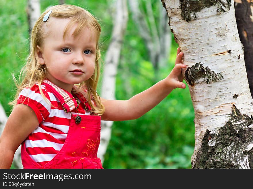 Beautiful girl near the tree outdoor