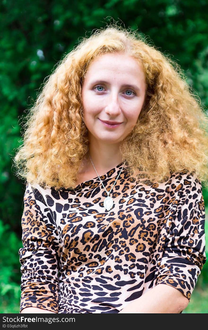 Portrait of a beautiful red-haired girl outdoor