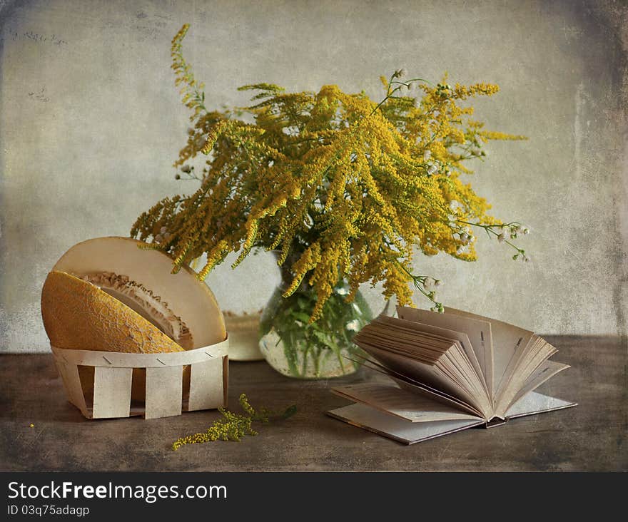 Still life with the yellow bouquet of flowers and melon. Still life with the yellow bouquet of flowers and melon