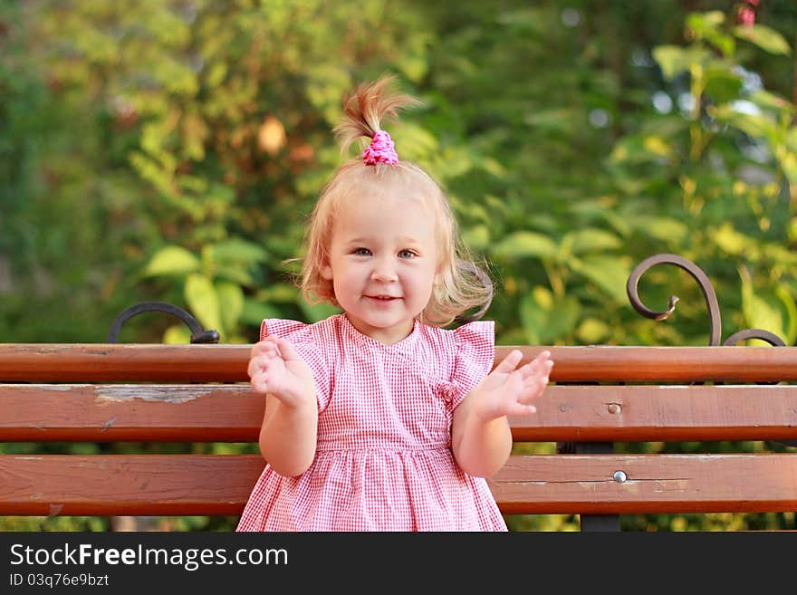 Close up of the little girl clapping her hands. Close up of the little girl clapping her hands