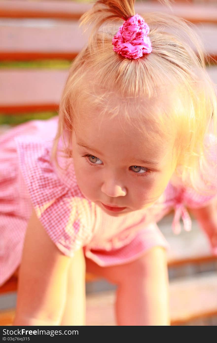 Portrait of the bended girl in a pink dress. Portrait of the bended girl in a pink dress