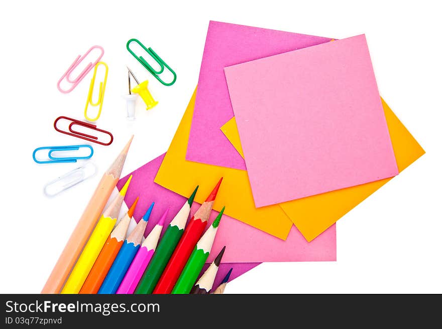 Colorful pencil, clips and note paper on white. Colorful pencil, clips and note paper on white