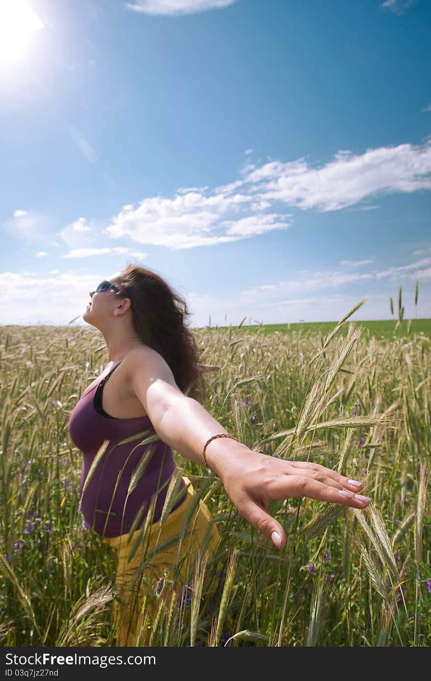 Pregnant Woman On Green Grass Field Under Blue Sky