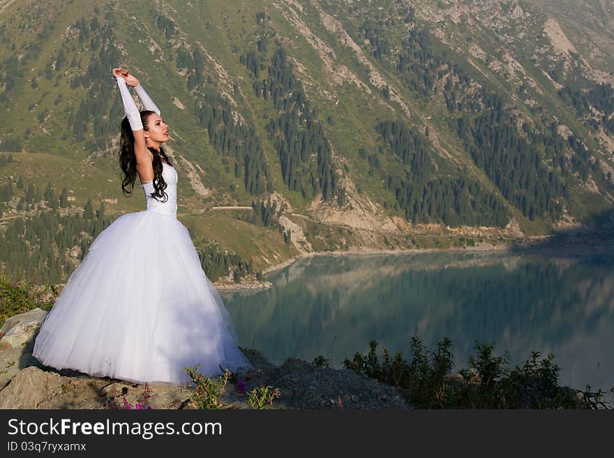 Beautiful bride by the lake