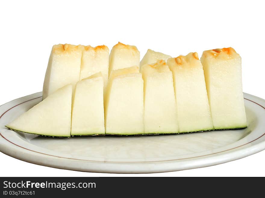 Sliced melon on the plate isolated over white background. Sliced melon on the plate isolated over white background