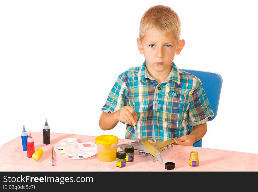 Boy paint airplane model