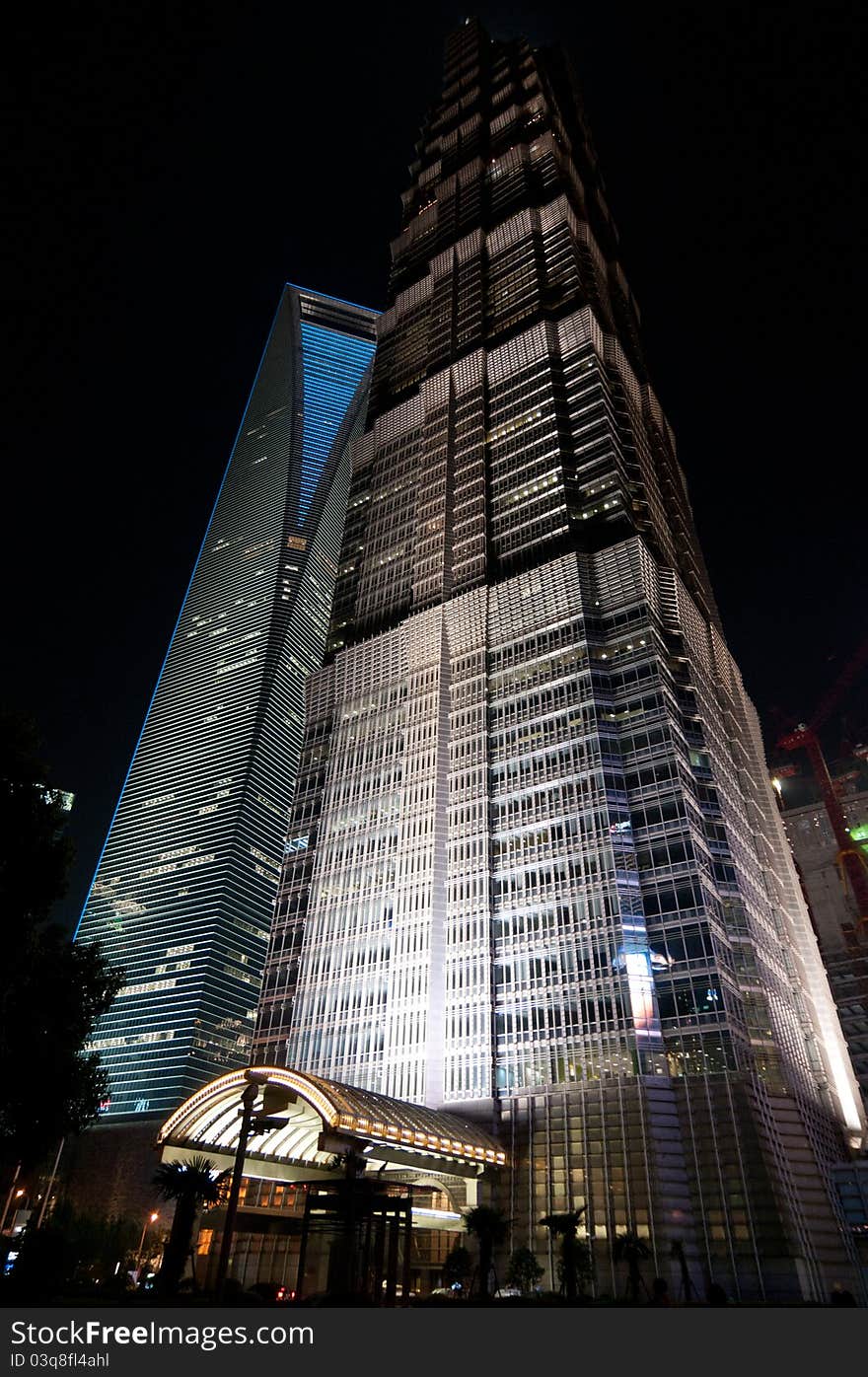 Suggestive view of skyscrapers in the Shanghai nightlife: the Jin Mao Tower and the World Financial Center. Suggestive view of skyscrapers in the Shanghai nightlife: the Jin Mao Tower and the World Financial Center