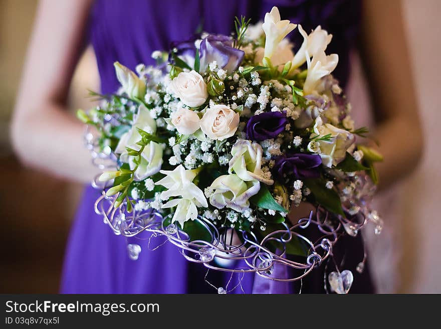 Wedding bouquet of the bride in table