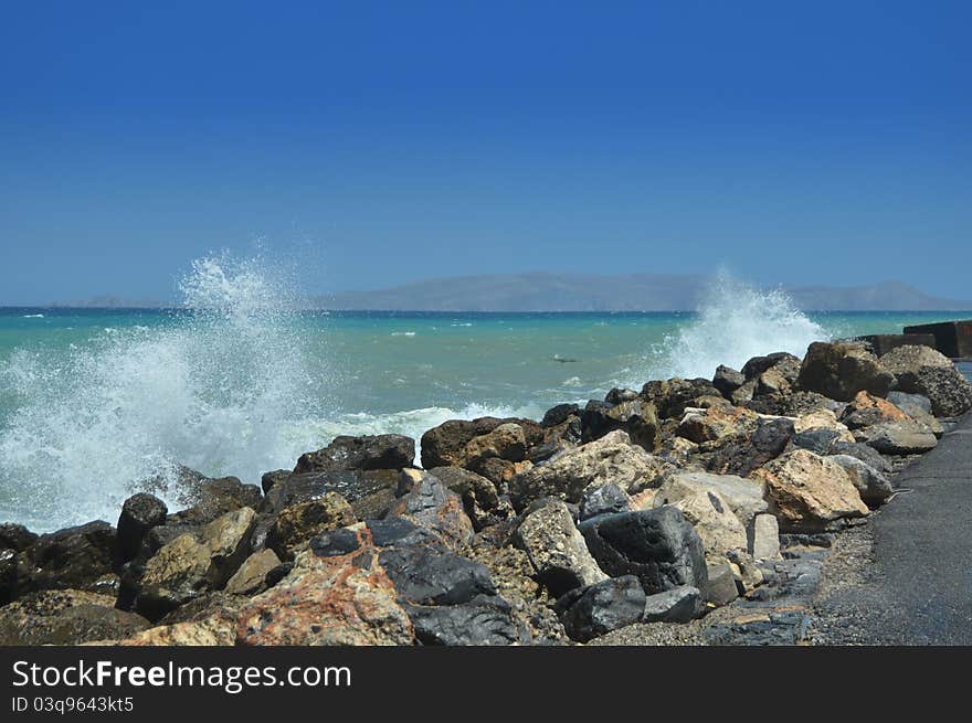 Splashes of breaking waves on the rocky shore