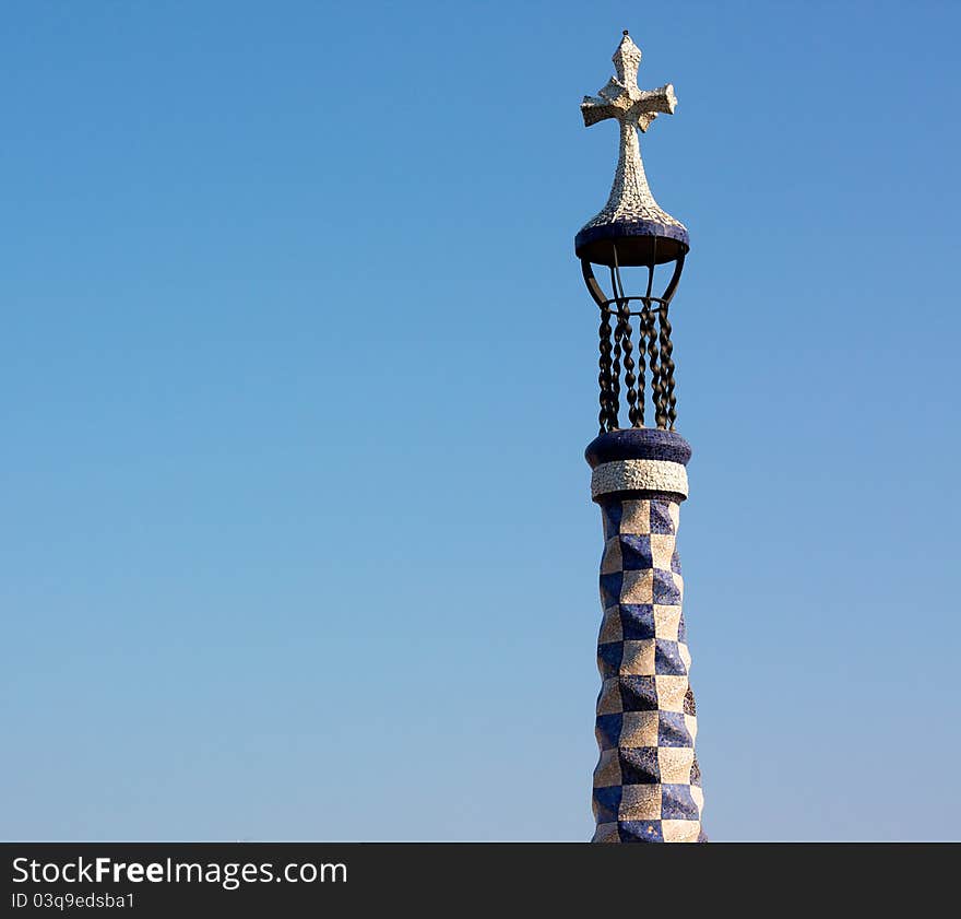 Gaudi's cross in a blue sky