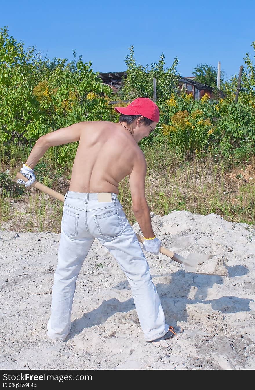 Back of a man with shovel