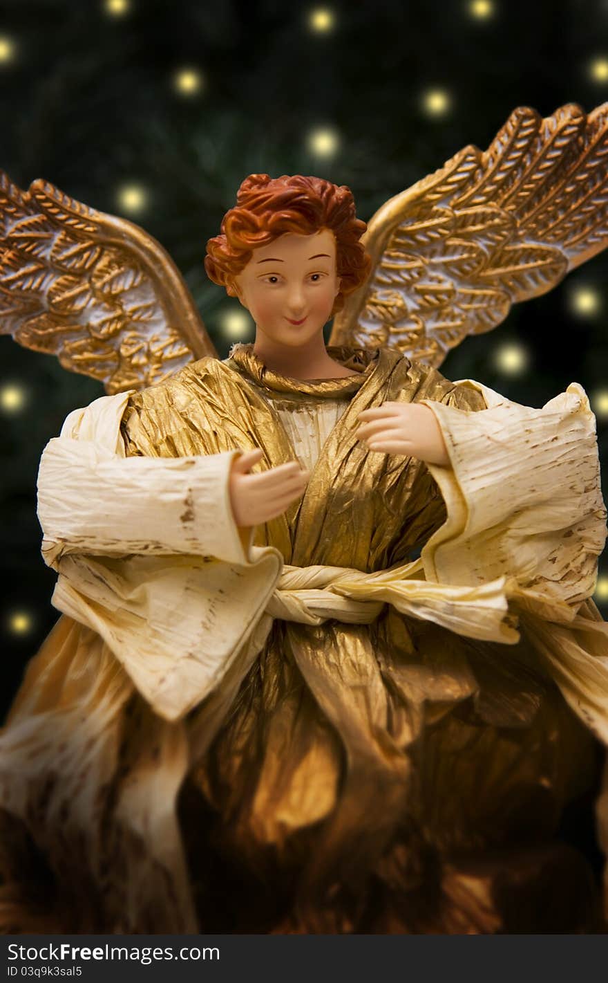 Smiling Christmas angel in tree