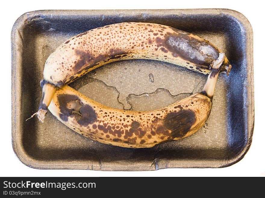 Rotten bananas in a bowl can be used as a background