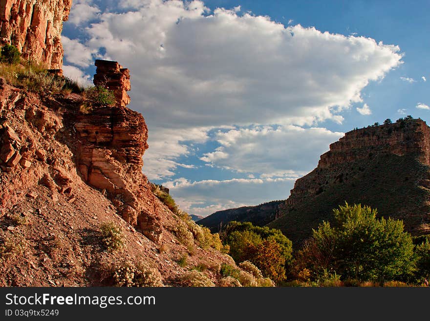 Image of a mountain landscape with blue sky and clouds. Image of a mountain landscape with blue sky and clouds