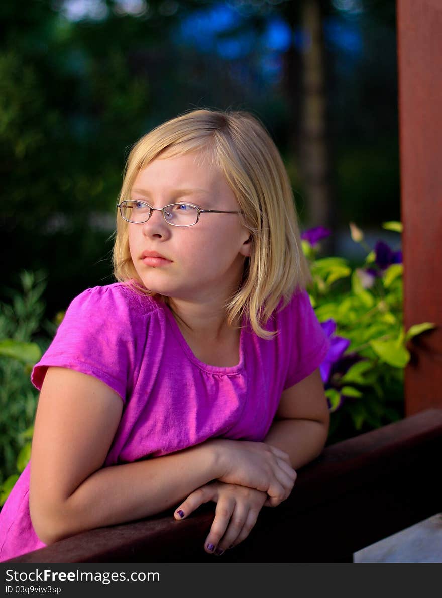 Portrait of a young female child looking into the sunset. Portrait of a young female child looking into the sunset