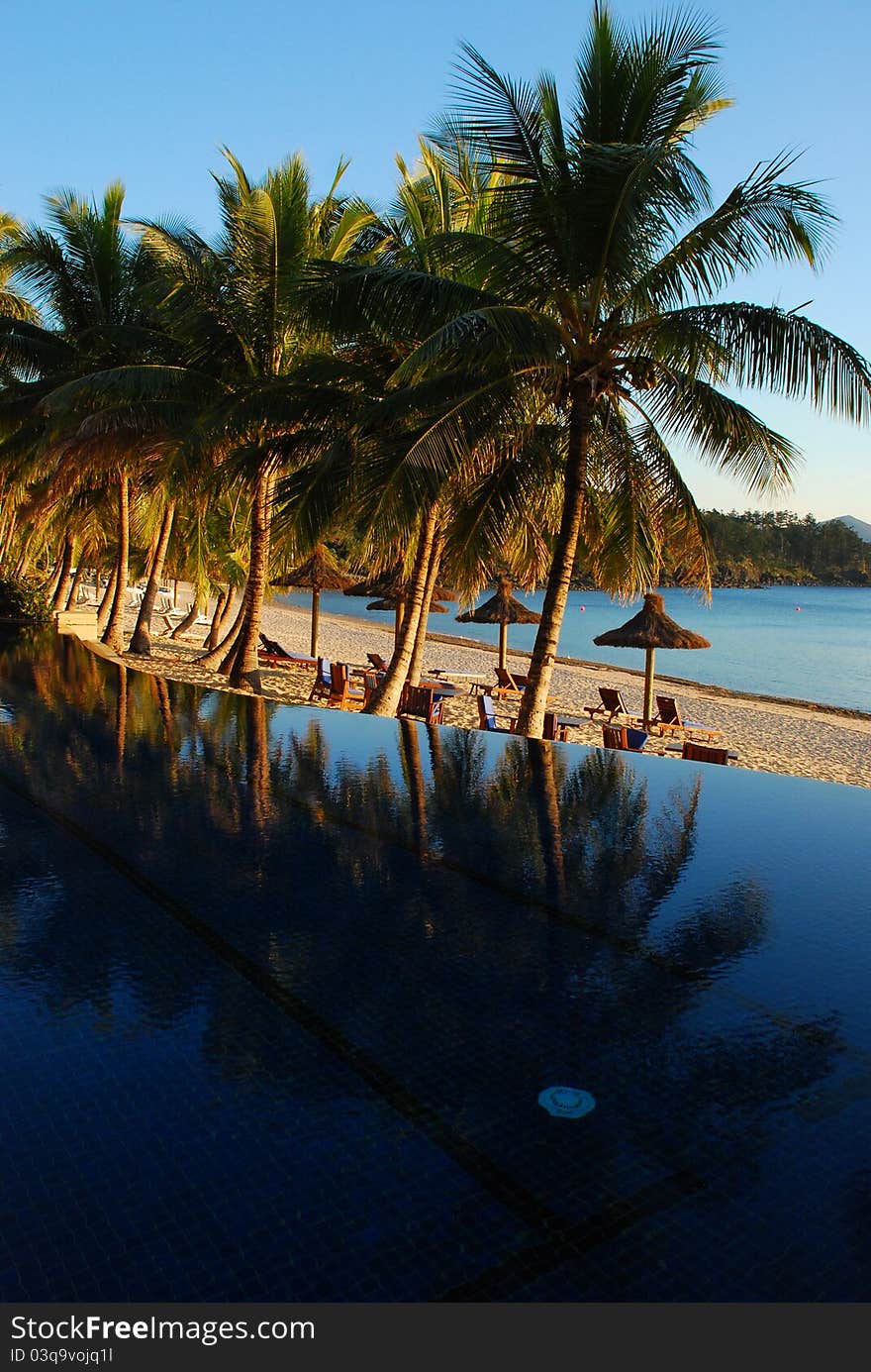 Sunrise on resort swimming pool, Hamilton Island, Australia