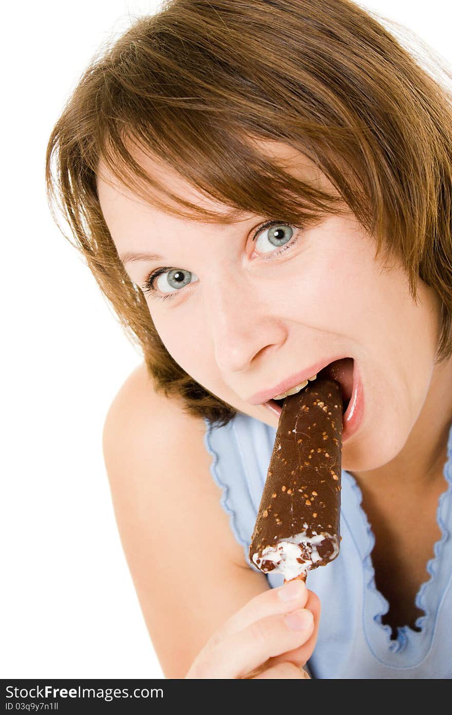 Woman eating ice cream on a white background.