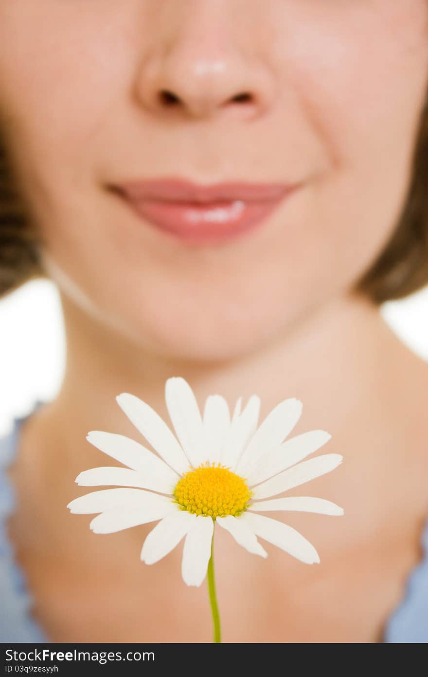 Girl Smelling A Flower.