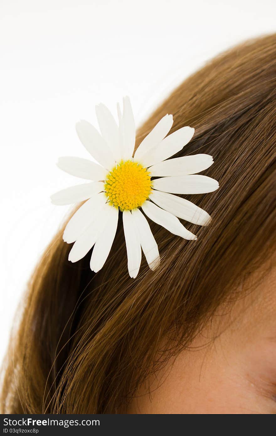 Girl with flower in her hair on a white background. Girl with flower in her hair on a white background.