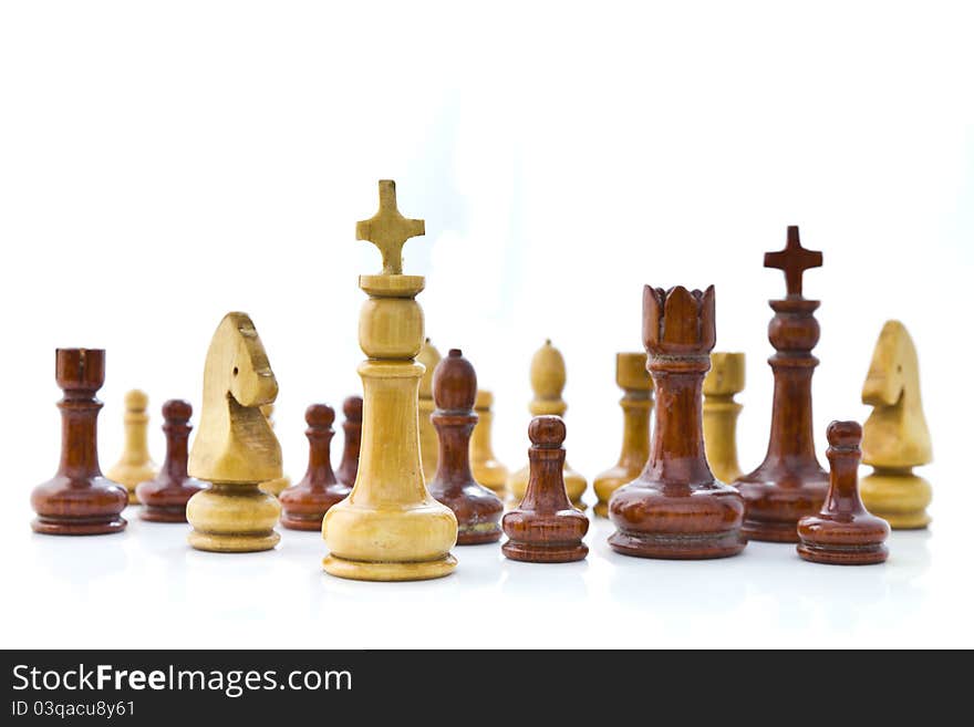 Wooden chess teams on white background. Wooden chess teams on white background