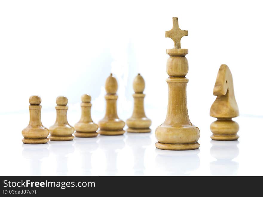 Wooden chess team on white background