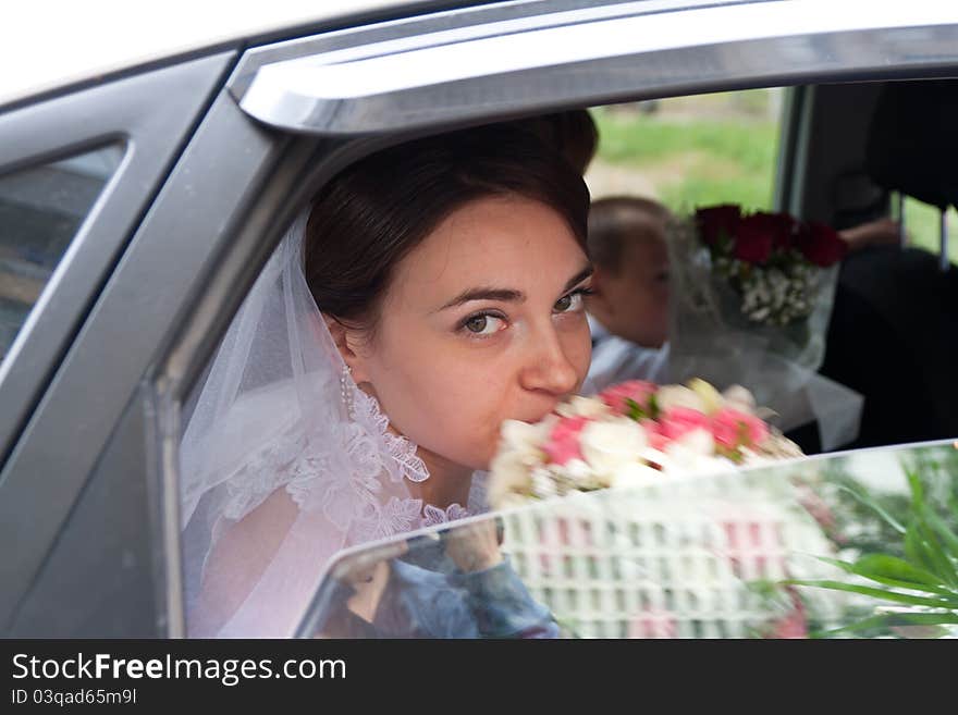 Beautiful Bride Looking Out From Car Window