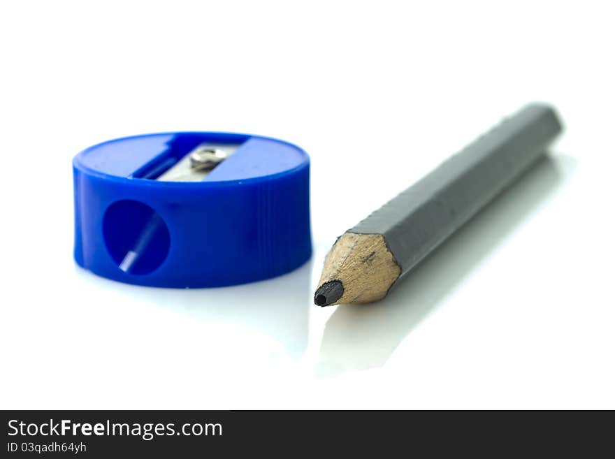 Black pencil and blue sharpener. Black pencil and blue sharpener