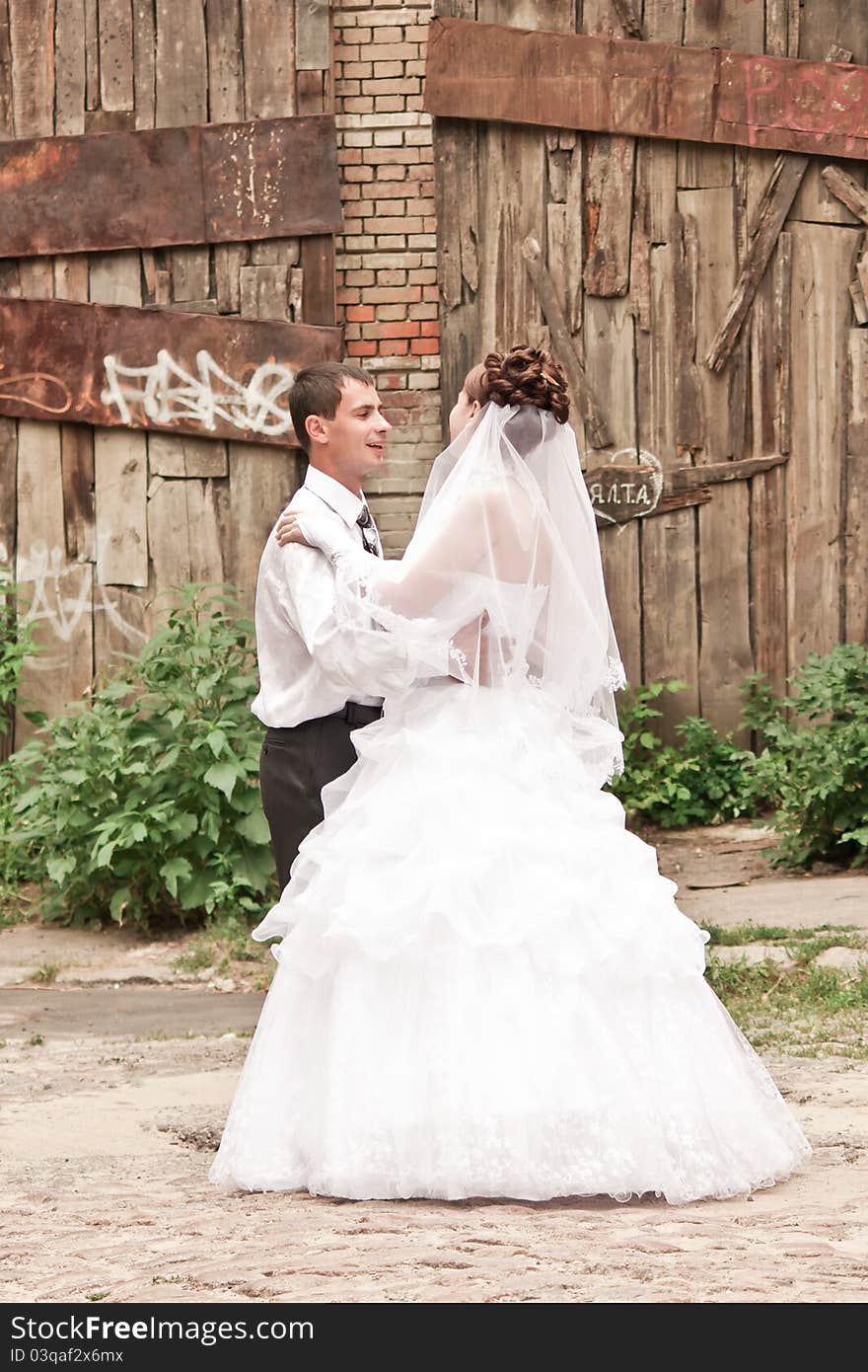 Bride and groom dancing outdoor