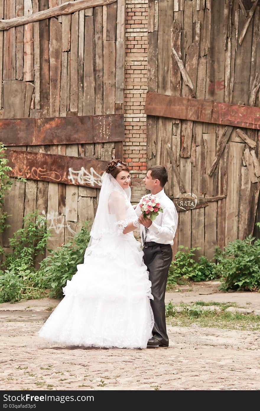 Bride and groom dancing outdoor