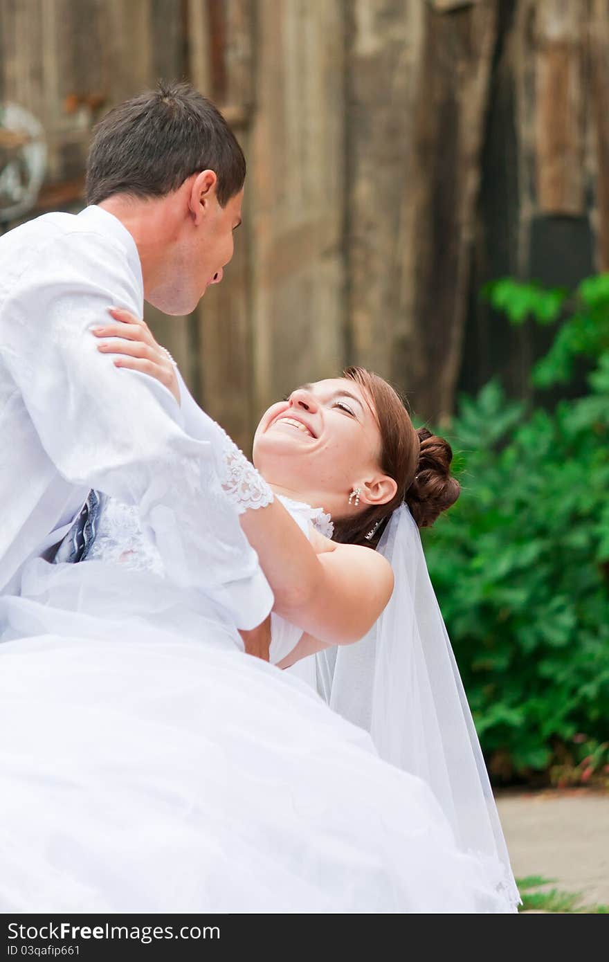 Bride and groom dancing outdoor