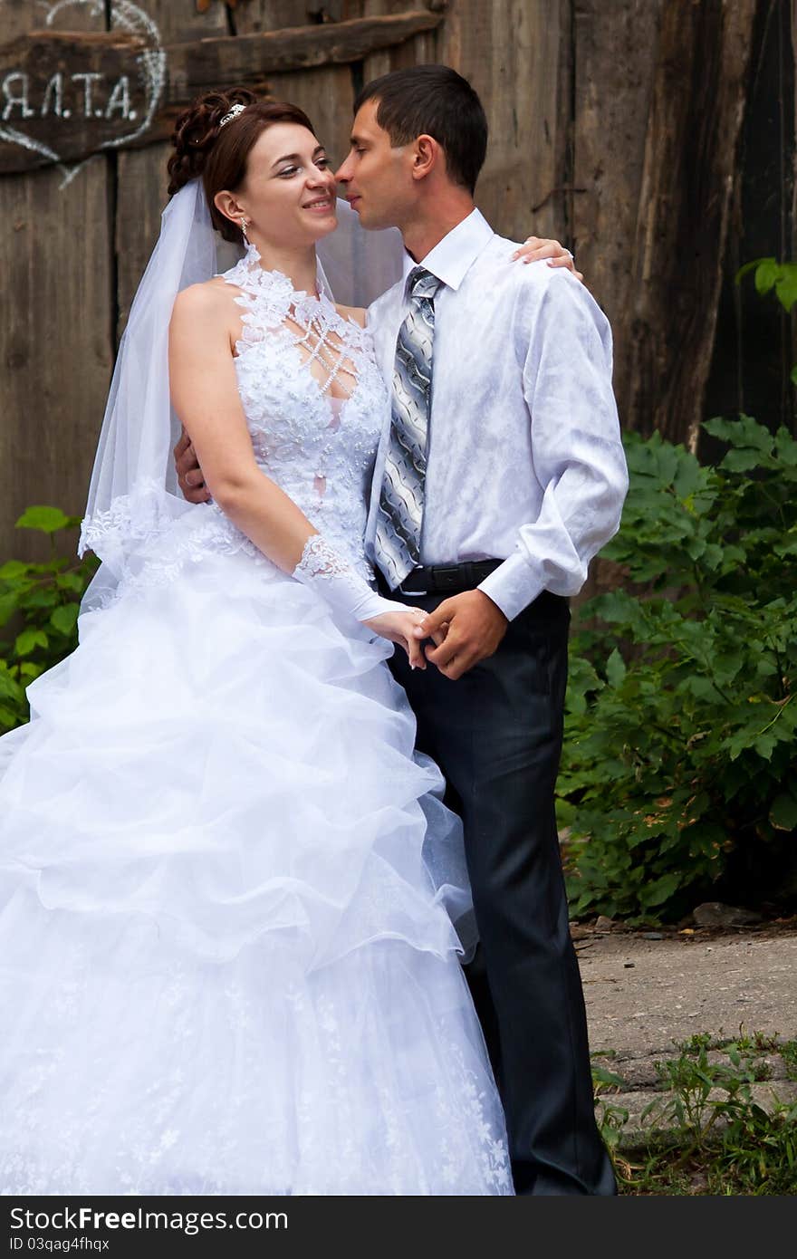 Bride and groom dancing outdoor