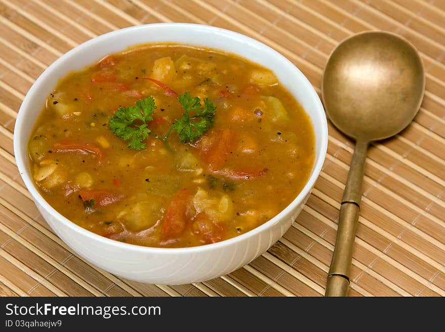 Vegetable soup on white plate