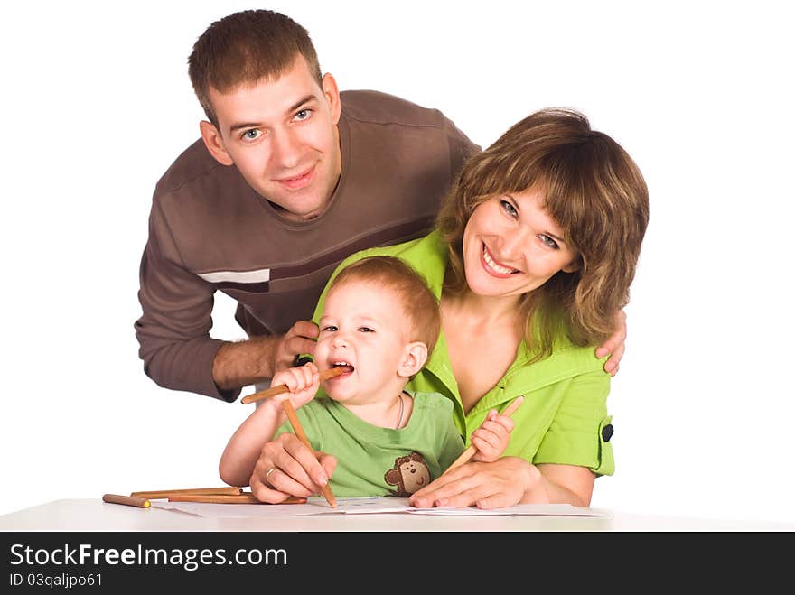 Portrait of a cute family drawing at table. Portrait of a cute family drawing at table