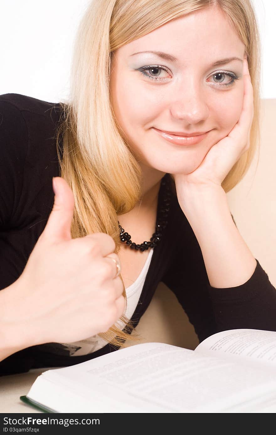 Portrait of a cute woman reading on a white