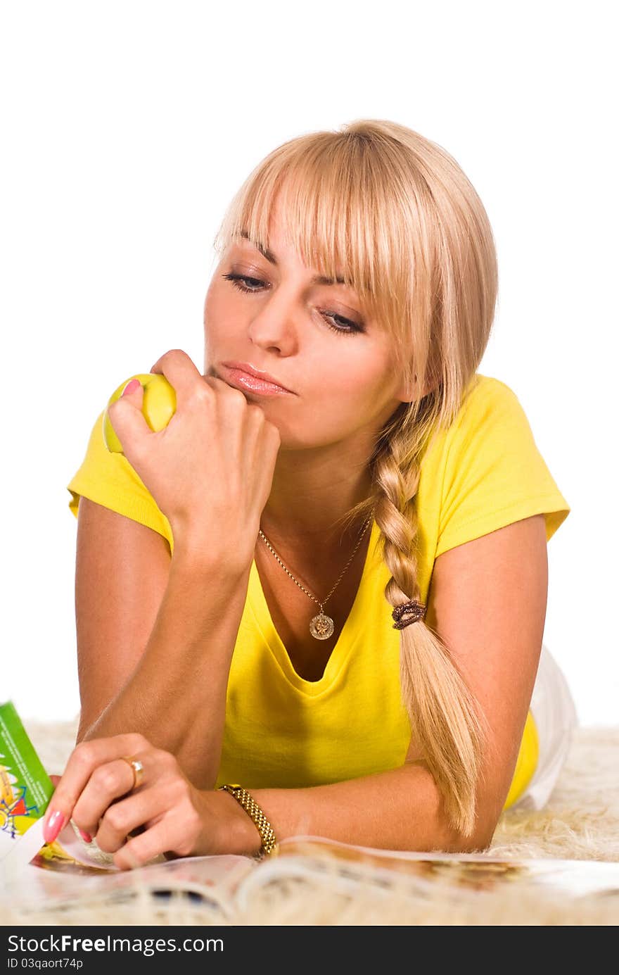 Girl At Carpet Reading With Apples