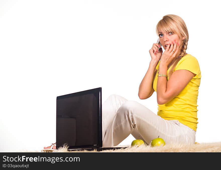 Cute girl lying on a carpet with laptop. Cute girl lying on a carpet with laptop