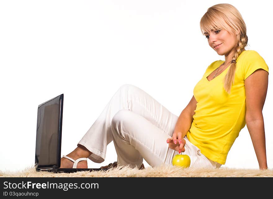 Cute girl lying on a carpet with laptop. Cute girl lying on a carpet with laptop