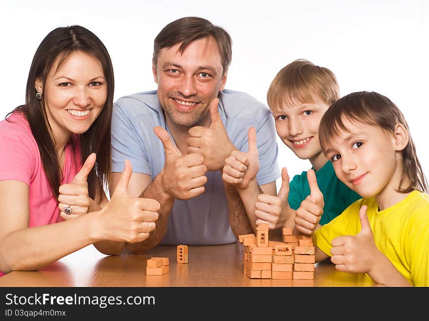 Happy family playing at table